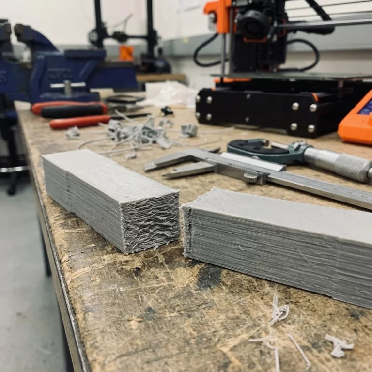 FDM layer adhesion strength test showing layer bonding in a printed plastic part