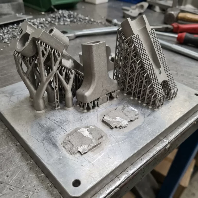 metal 3D printing support design showing tree lattice and breakaway supports under an SLM part
